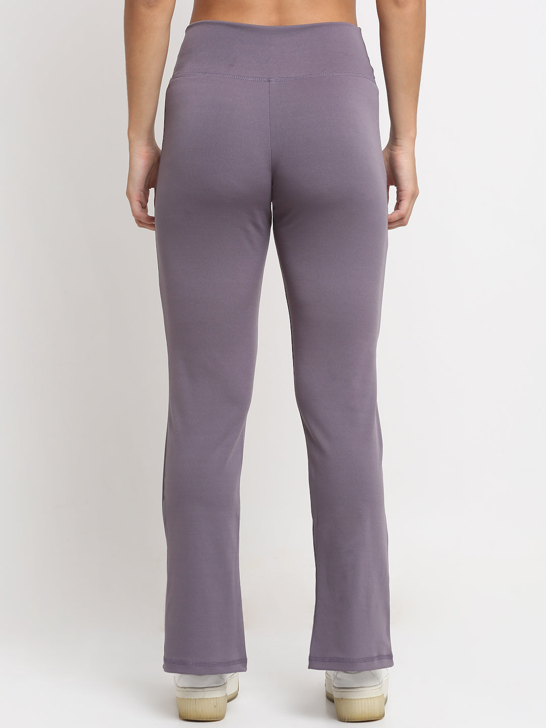 High-waisted lavender yoga pants with a front slit, featuring a skinny waistband and elevated front seams. The pants are designed with a flared 