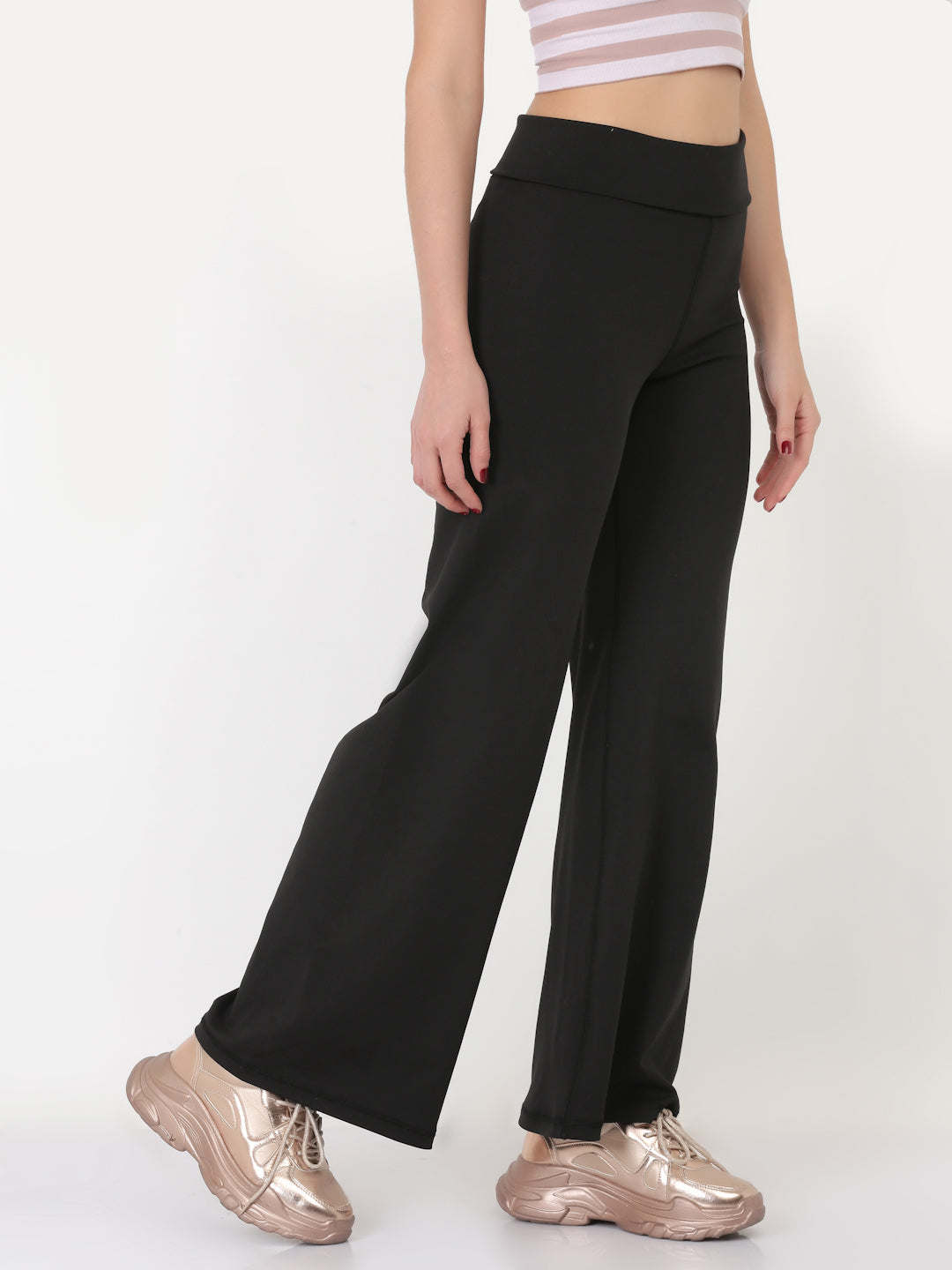 A pair of black ultra flare leggings featuring a foldover waistband, designed for comfort and style.