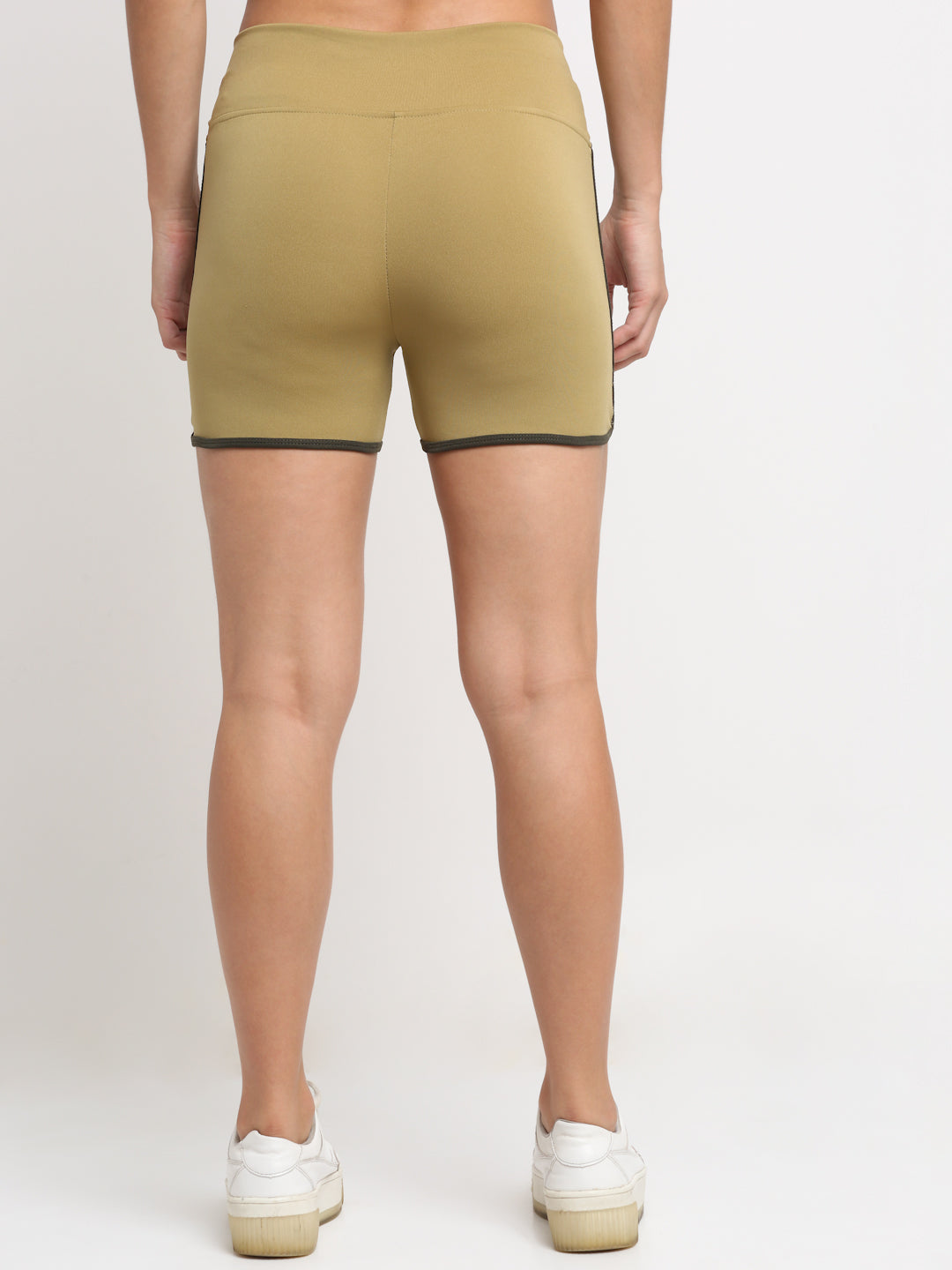 A pair of khaki active running shorts for women with contrasting piping on the sides.