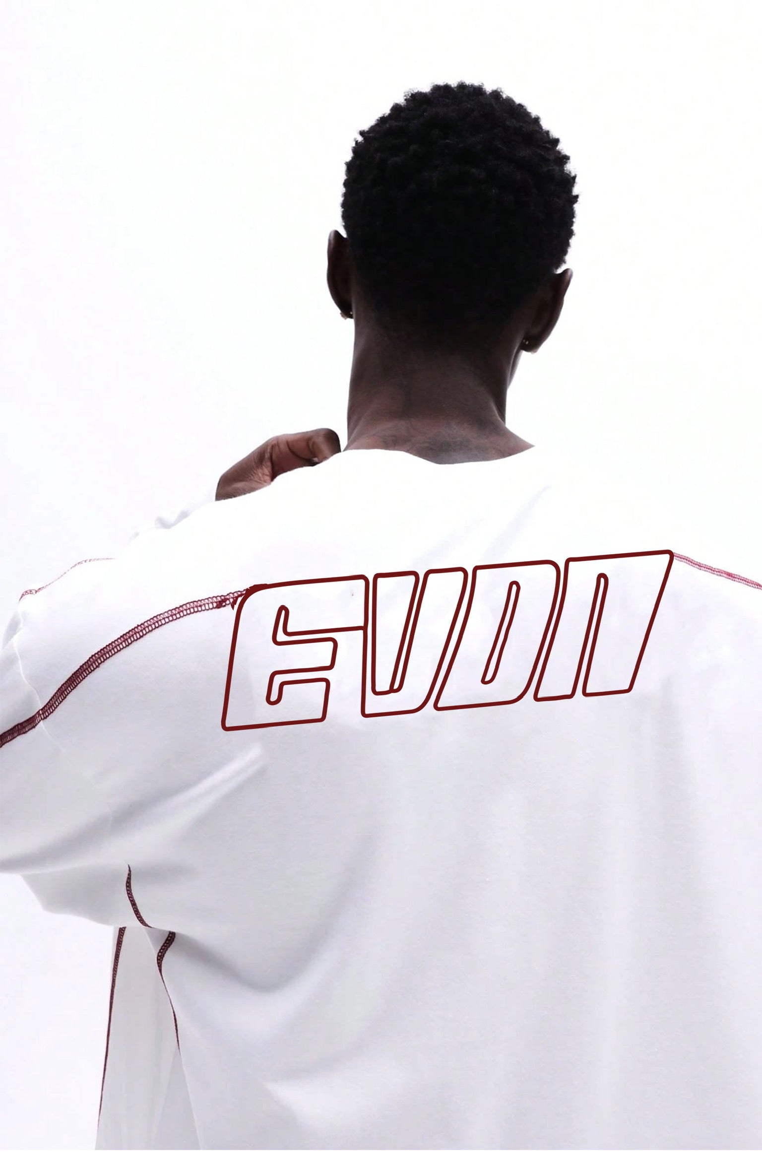 Person wearing a white shirt with 'EVERDION' printed on the back against a white background