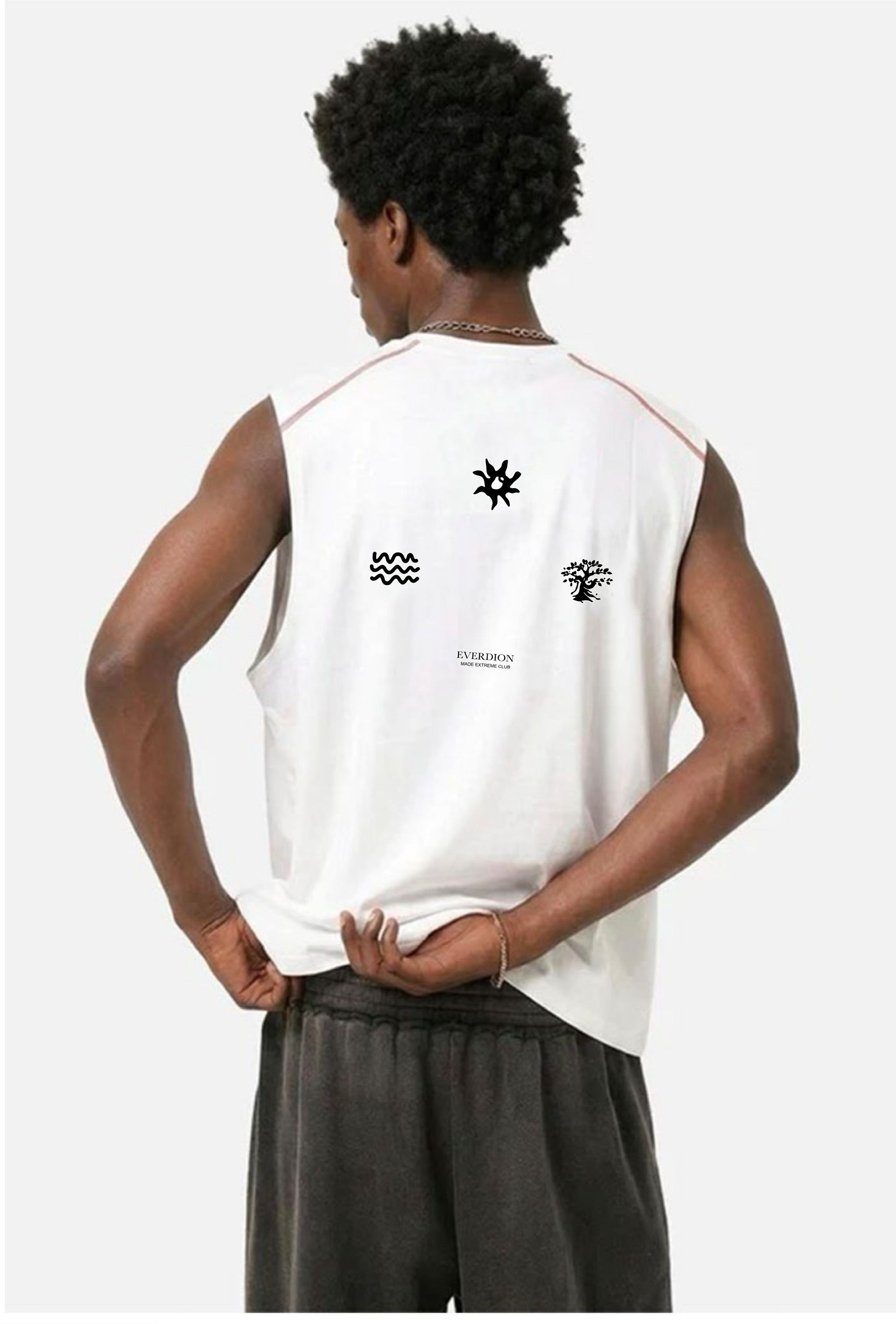 Person wearing a white sleeveless shirt with black graphics on a white background