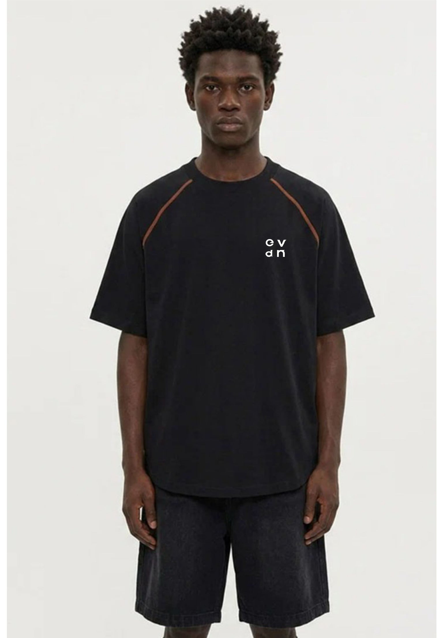 Person wearing a black t-shirt with a logo on a white background