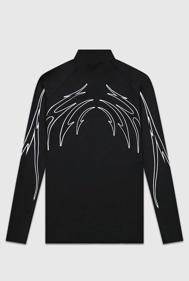 Black long-sleeve top with white abstract designs on a light grey background
