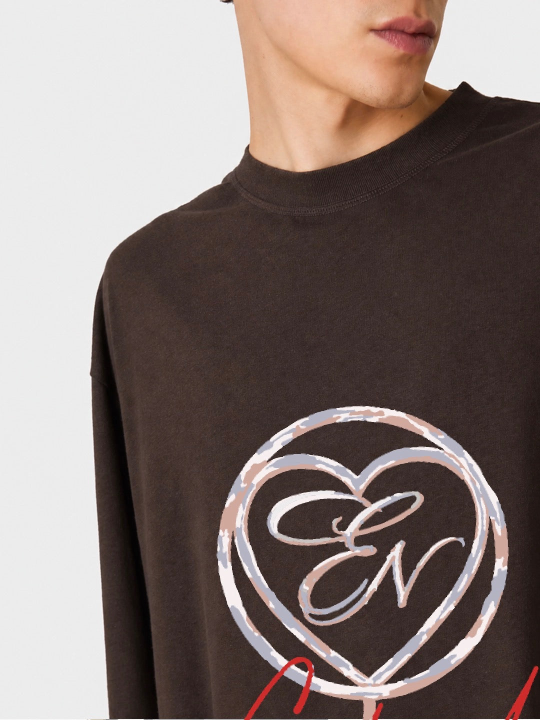 Black sweatshirt with silver heart-shaped logo on a plain background