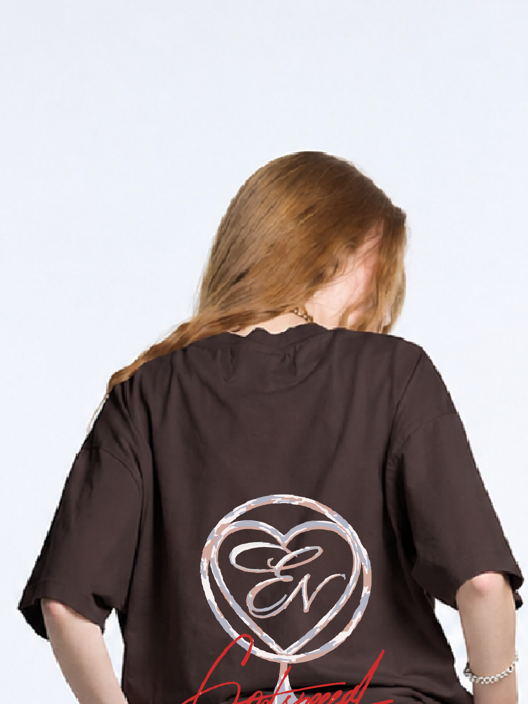 Person wearing a brown t-shirt with a logo on the back against a white background