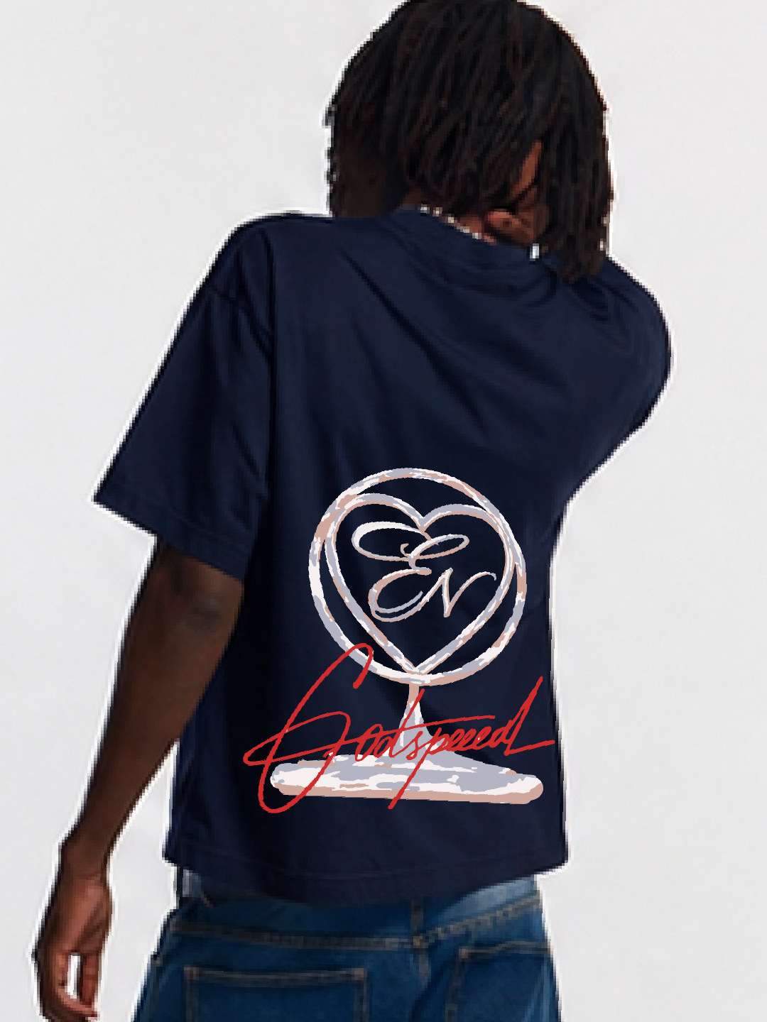 Person wearing a navy blue t-shirt with a logo and text on the back against a white background