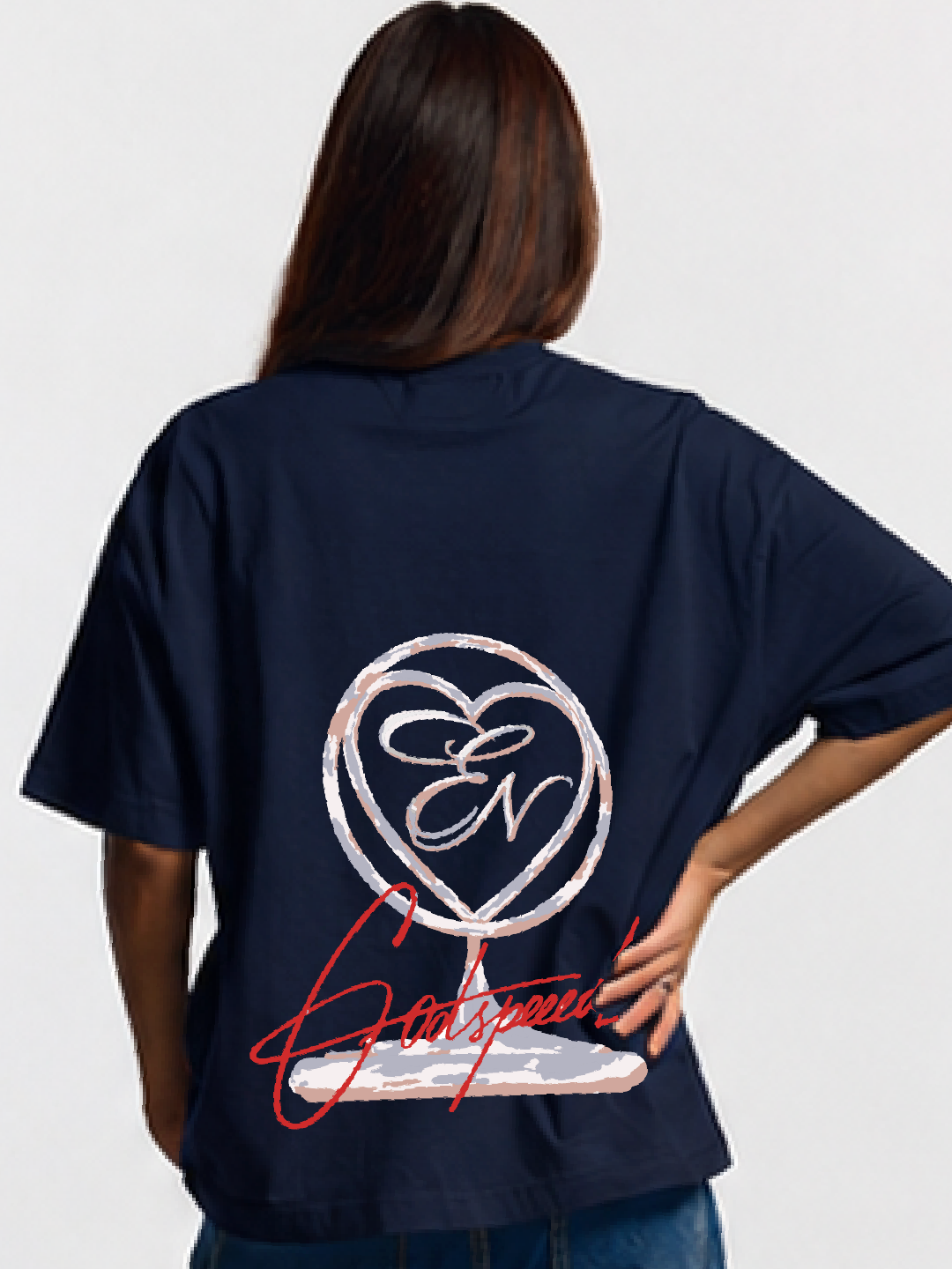 Person wearing a navy blue t-shirt with a logo and text on the back, standing against a plain background.