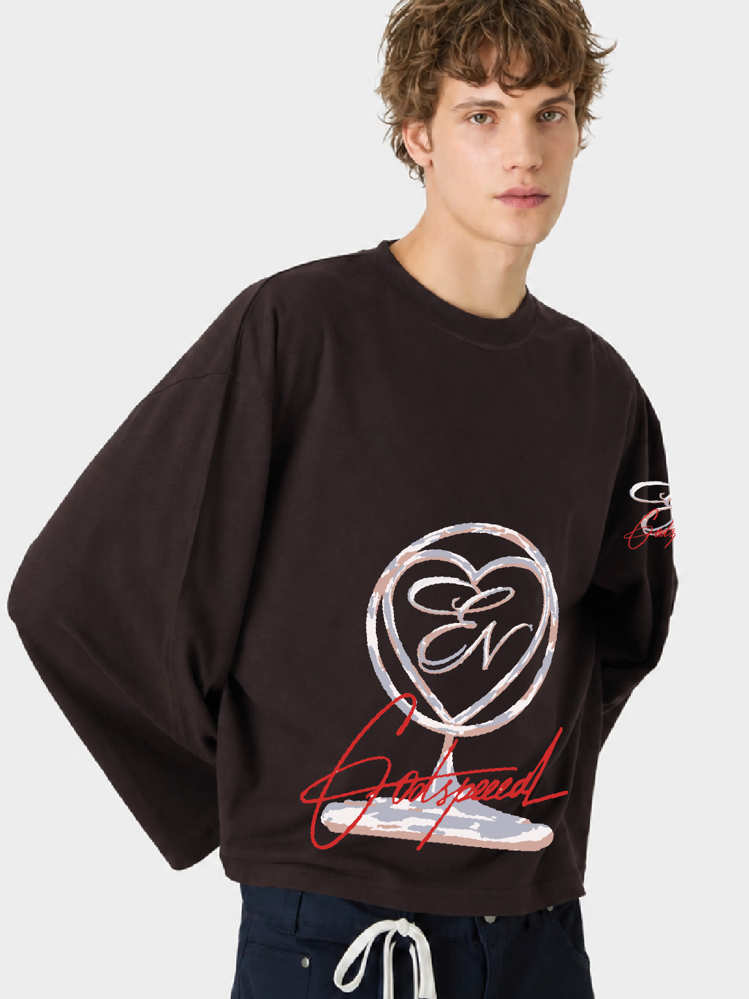Person wearing a black sweatshirt with a logo and text on a white background