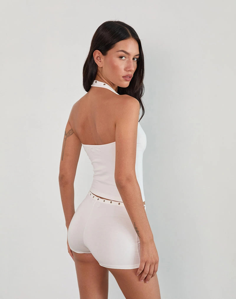 White Halter Neck Top and Shorts Set brings together bold design. Crafted to flatter with a sleek halter neckline and matching shorts, this set delivers a confident look.