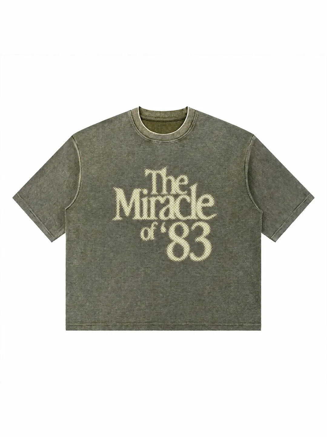 A short-sleeve crewneck t-shirt in a washed olive green color, featuring the text 'The Miracle of 83' printed in a cream-colored serif font on the front.