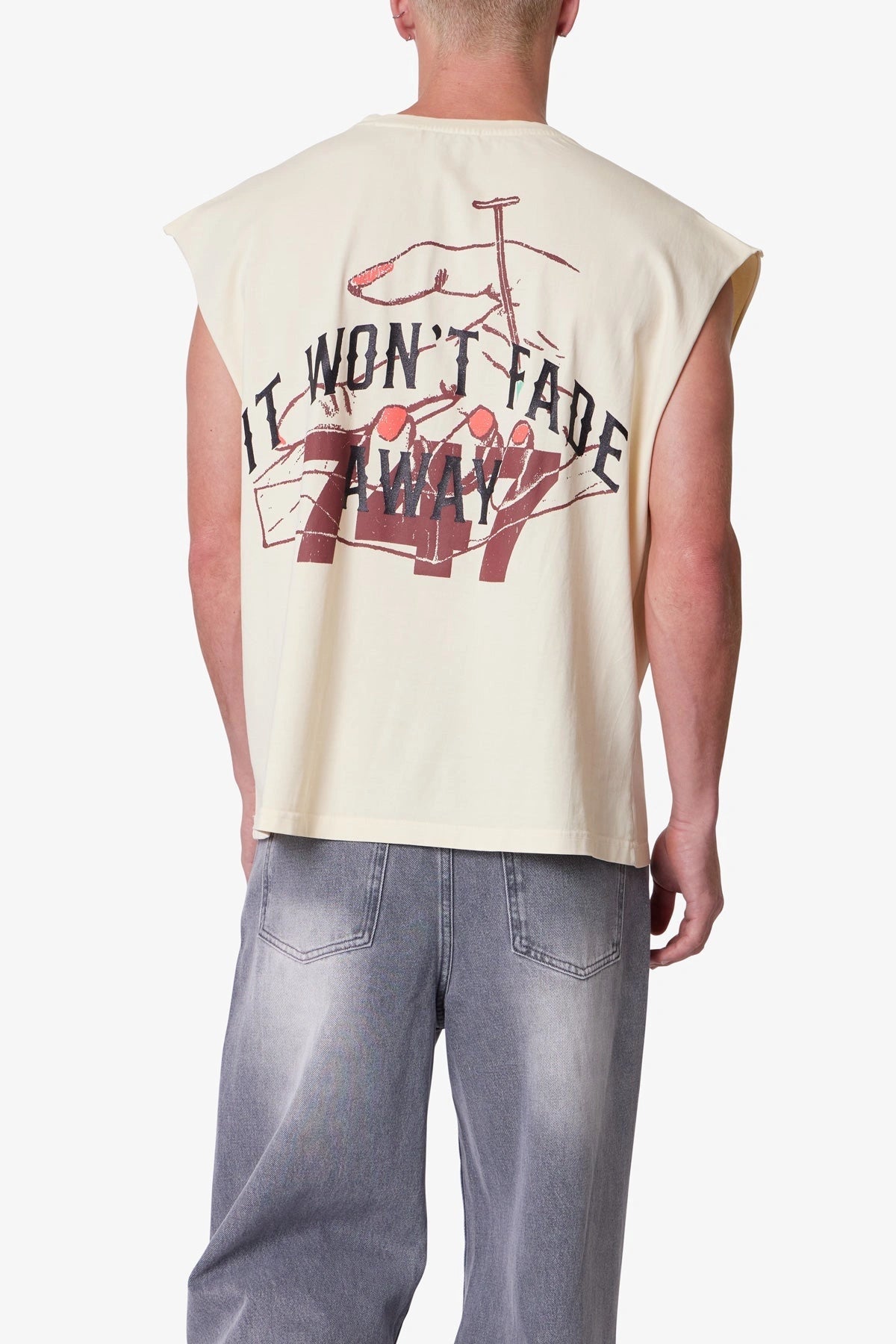 Back of Men’s beige sleeveless printed tank top with notched crew neck, oversized fit, and bold distressed streetwear print