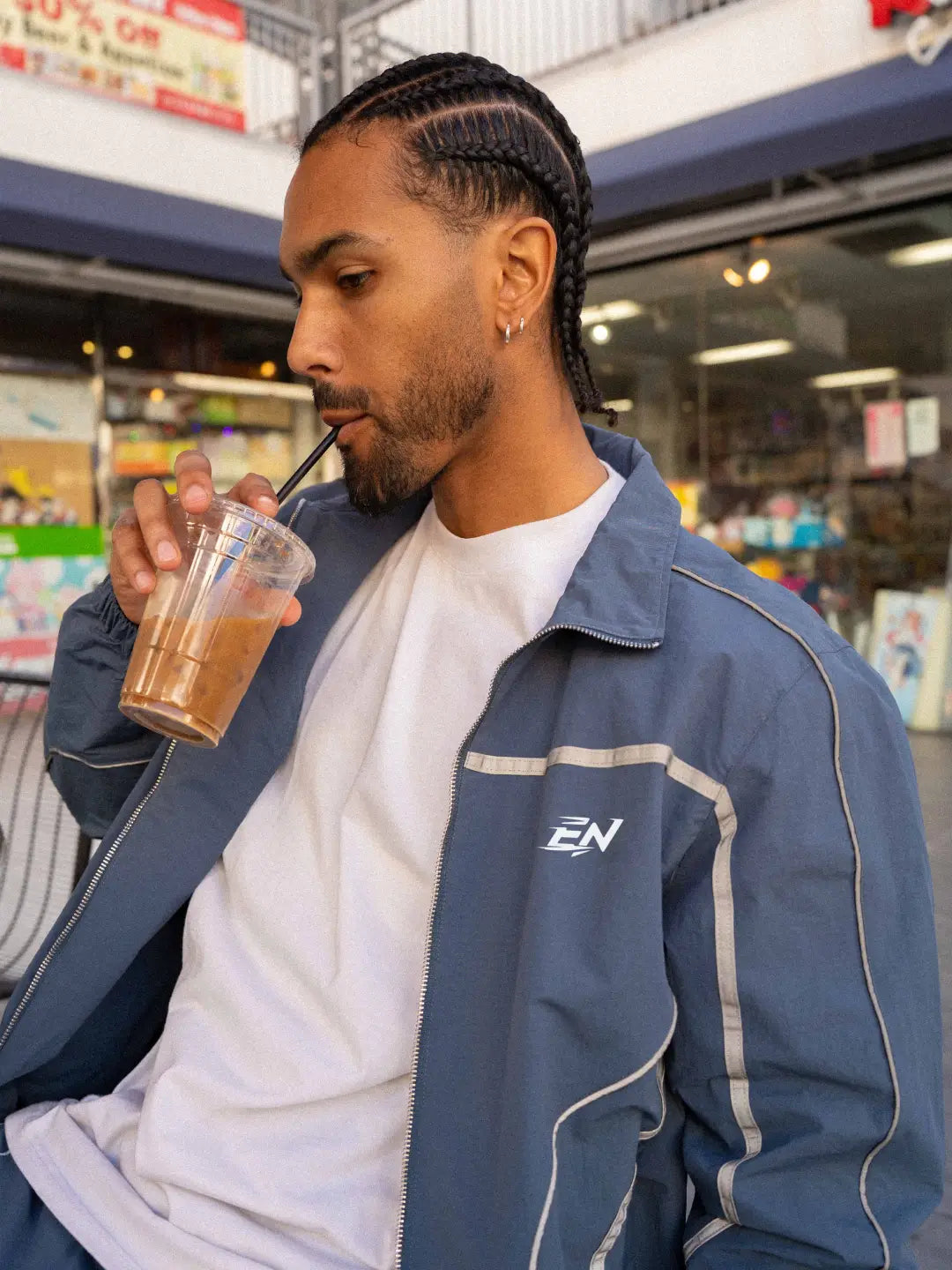 The Blue jacket delivers a structured yet lightweight feel, while the relaxed-fit track pants ensure fluid movement and all-day comfort. 