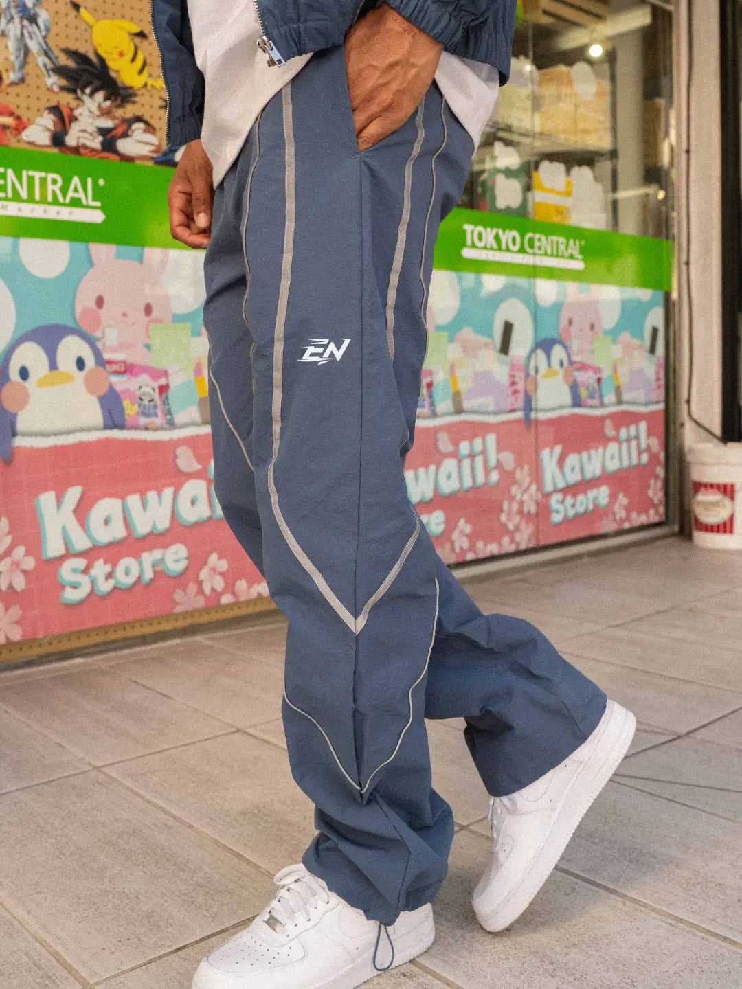 The Blue pant delivers a structured yet lightweight feel, while the relaxed-fit track pants ensure fluid movement and all-day comfort. 