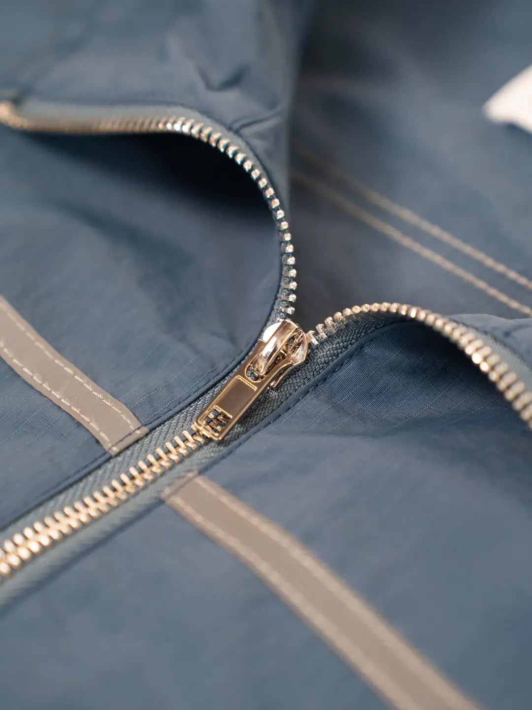 The Blue jacket delivers a structured yet lightweight feel, while the relaxed-fit track pants ensure fluid movement and all-day comfort. 