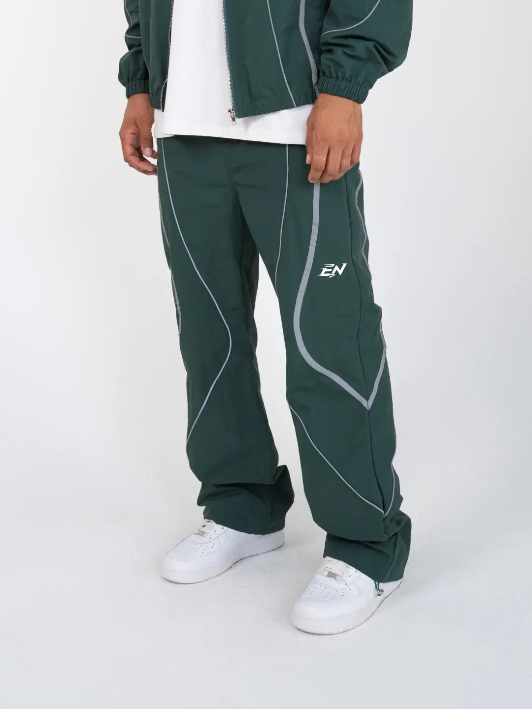 The Forest Green Pant delivers a structured yet lightweight feel, while the relaxed-fit track pants ensure fluid movement and all-day comfort. 