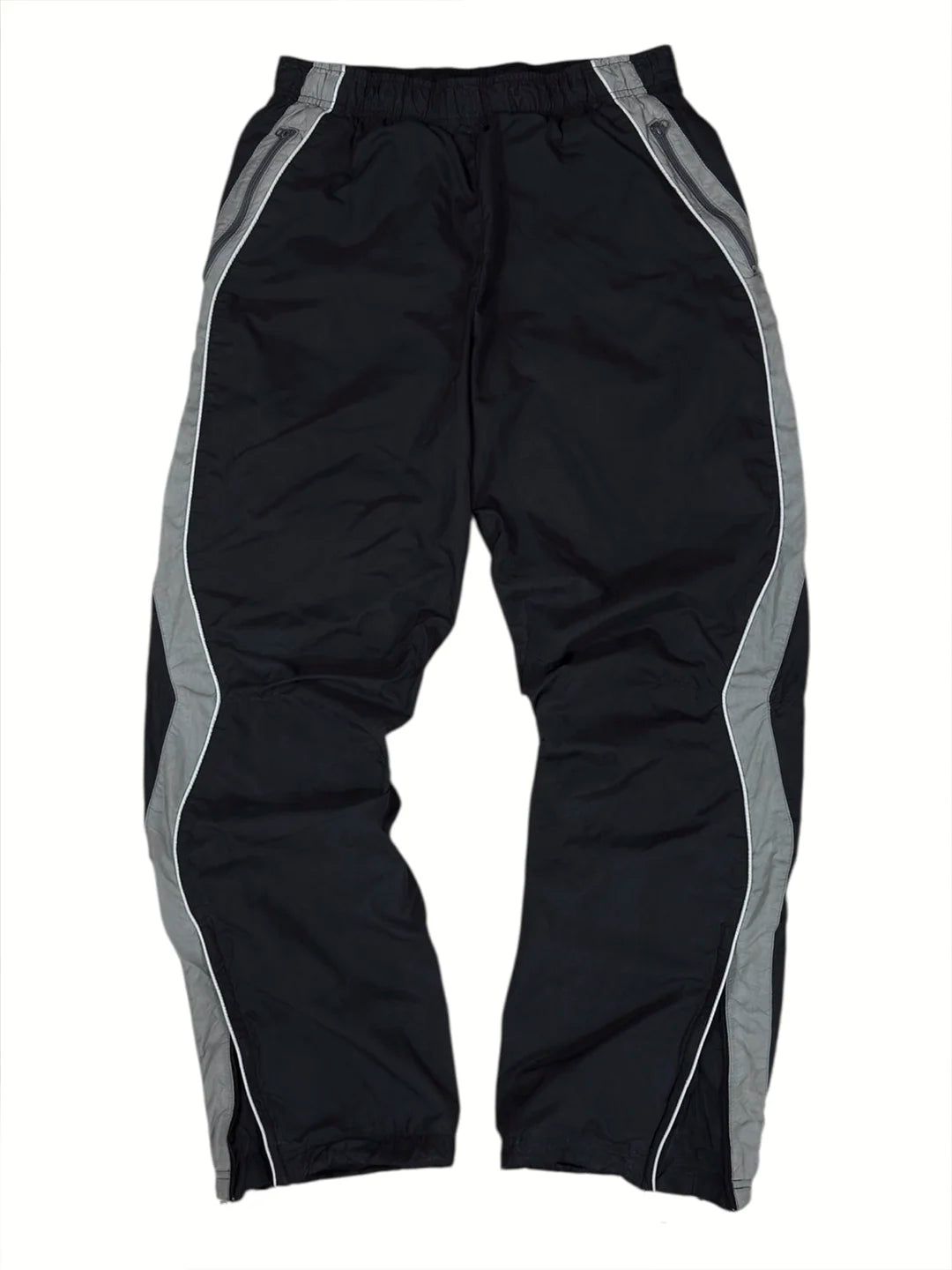 Black athletic pants with grey side panels and white piping details, shown flat against a white background.