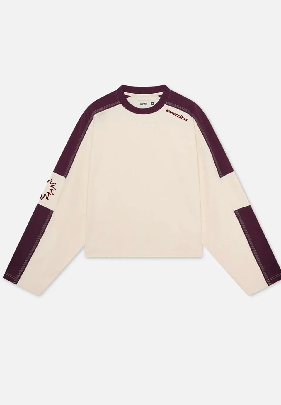 A long-sleeve colorblock t-shirt by Everdion, featuring an off-white body with dark plum purple shoulder and sleeve panels, displayed flat against a light grey background.