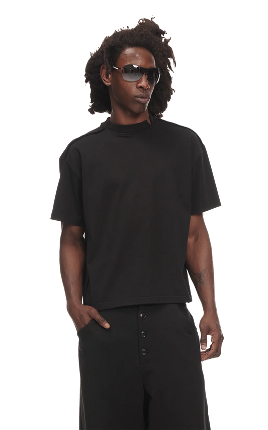 Person wearing a black t-shirt and sunglasses on a white background