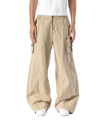Beige cargo pants worn by a person on a white background
