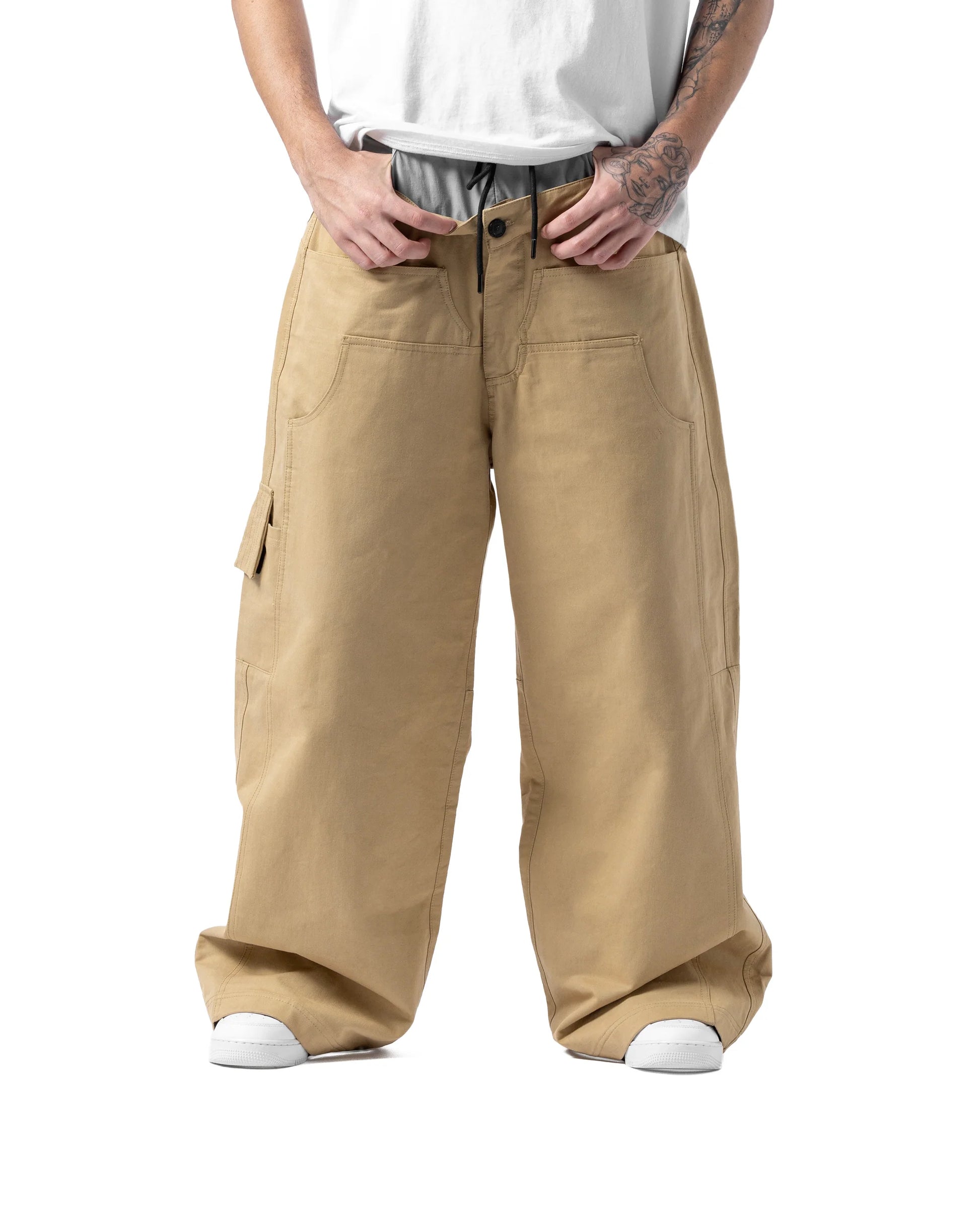 Person wearing beige wide-leg cargo pants on a white background