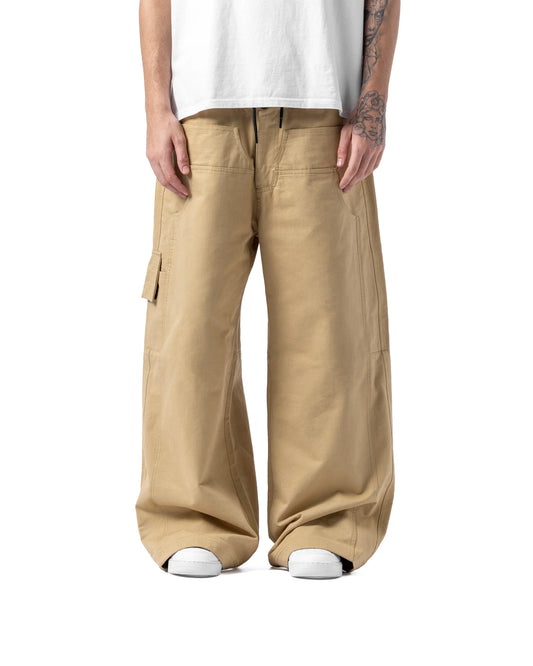 Person wearing beige cargo pants and a white shirt on a white background