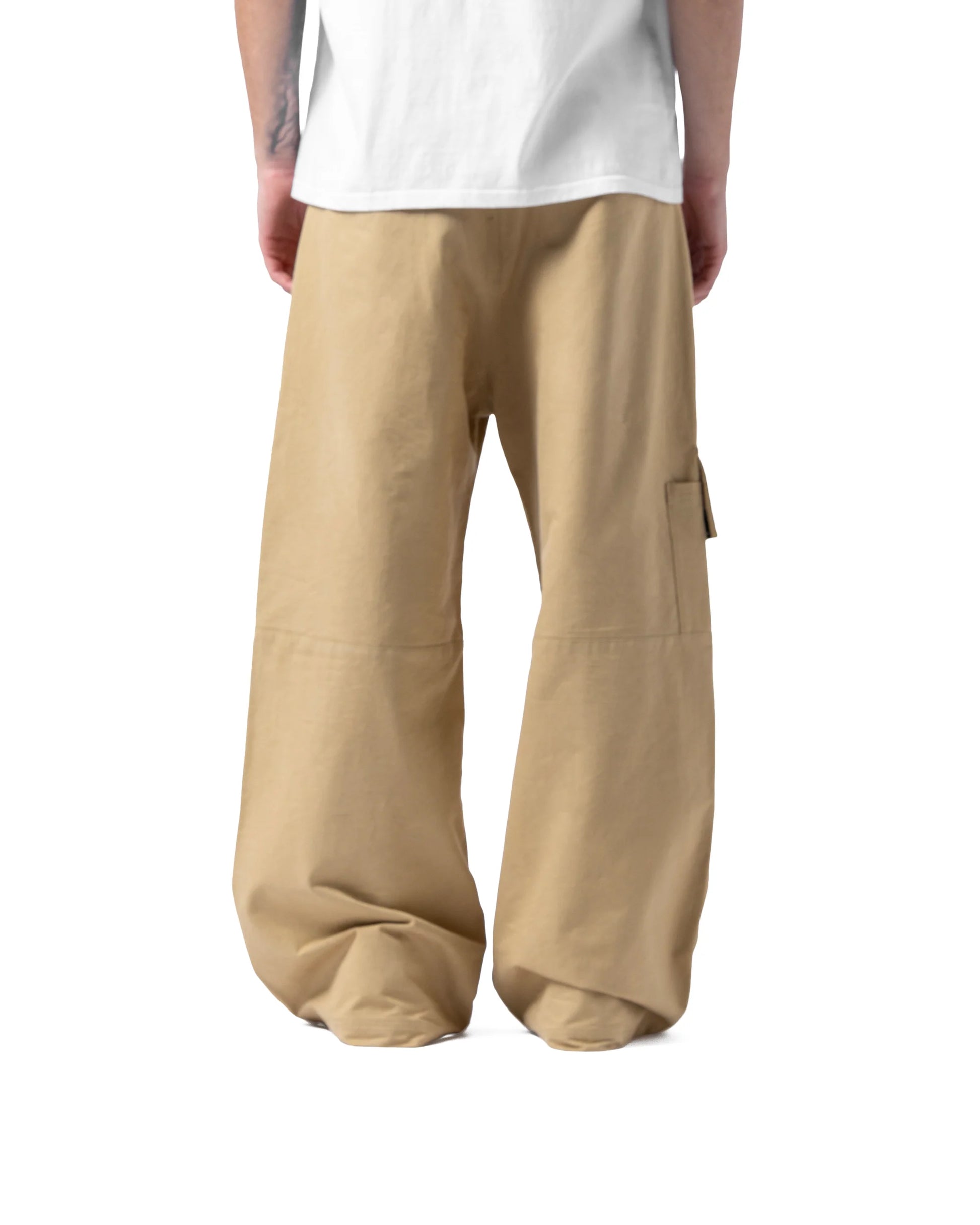 Beige cargo pants worn by a person on a white background