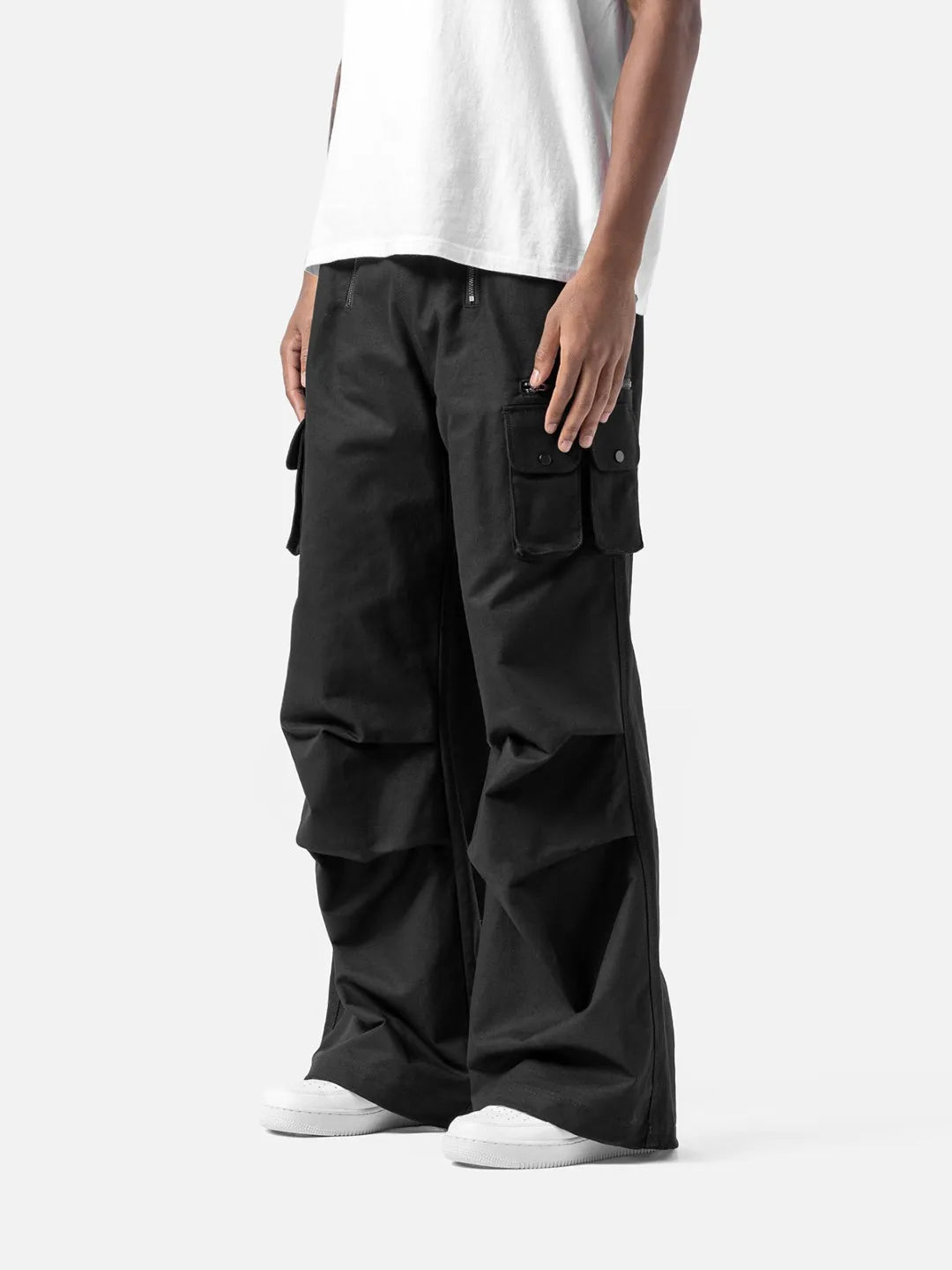 Black cargo pants with adjustable drawstrings and pockets on a white background