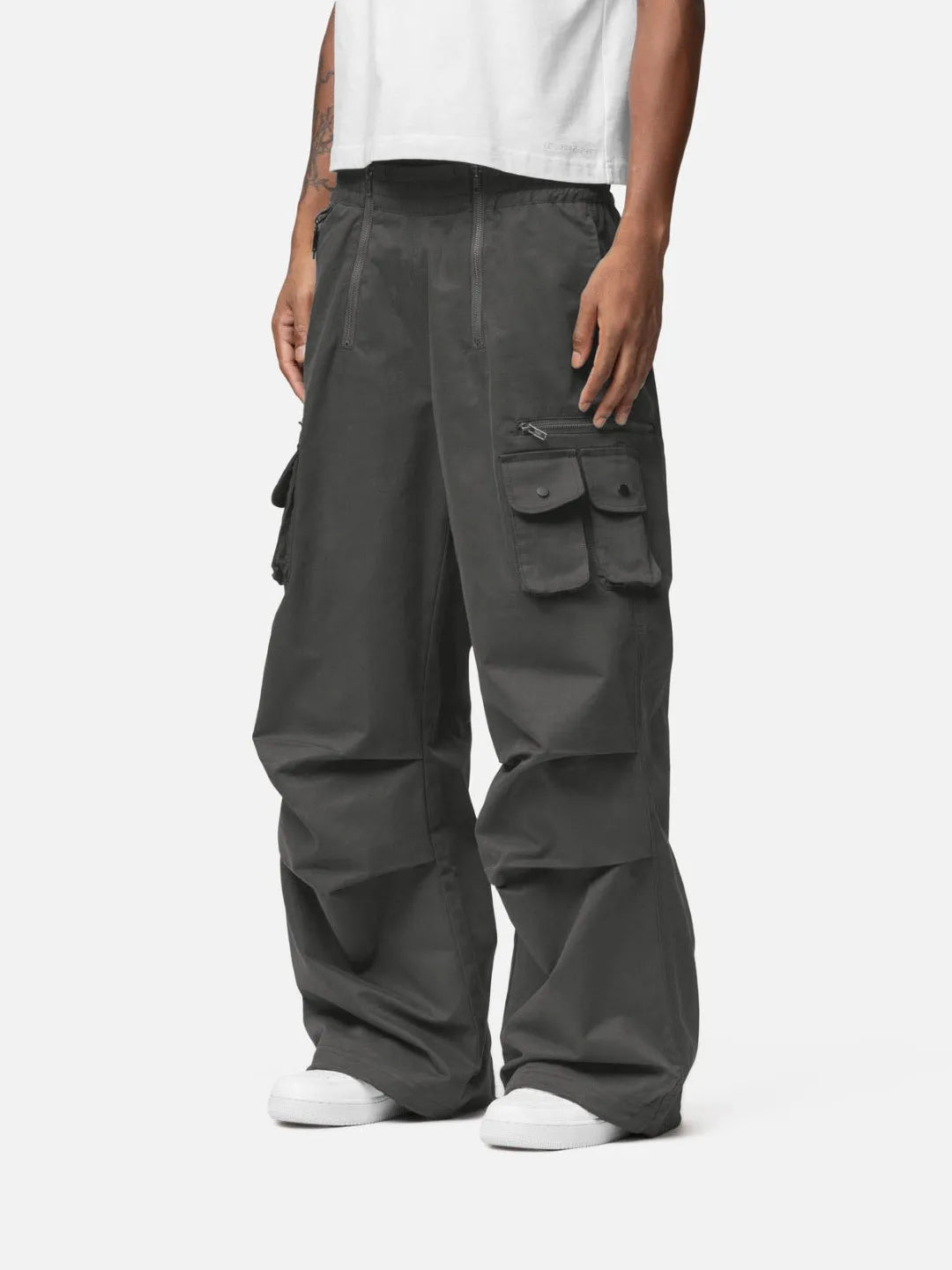 Grey cargo pants with adjustable drawstrings and pockets on a white background