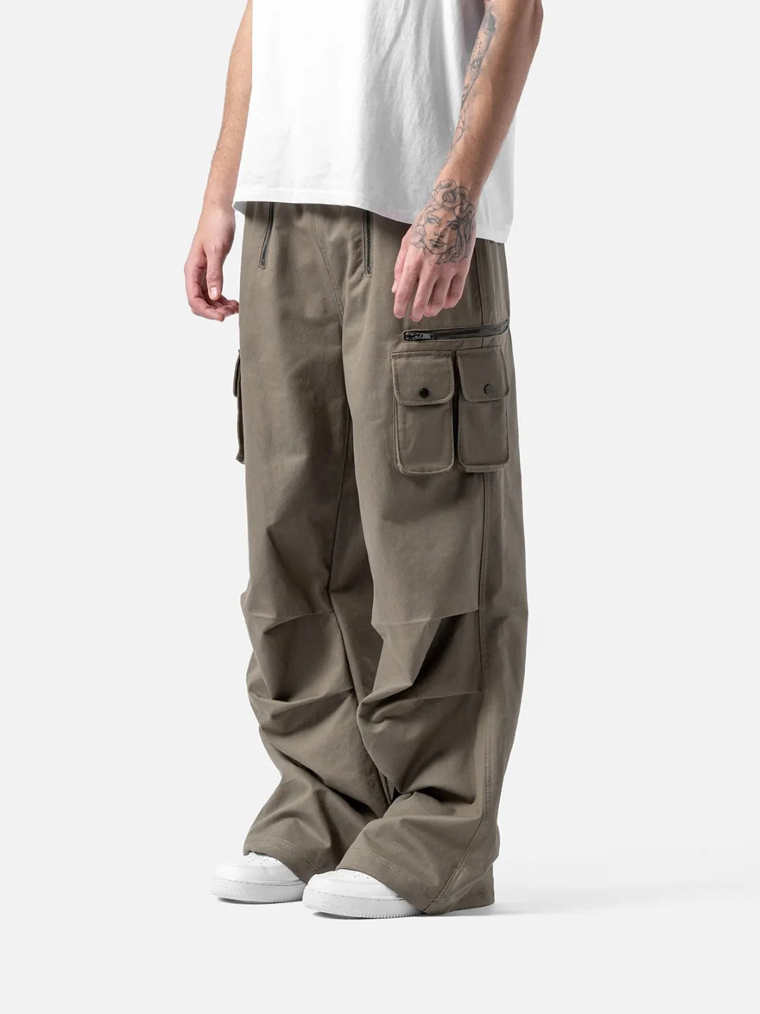 Beige cargo pants with adjustable drawstrings and pockets on a white background