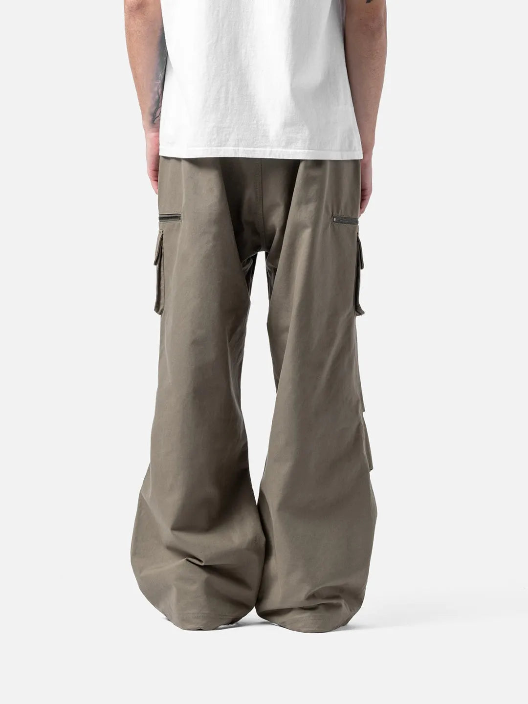 Beige cargo pants with adjustable drawstrings and pockets on a white background