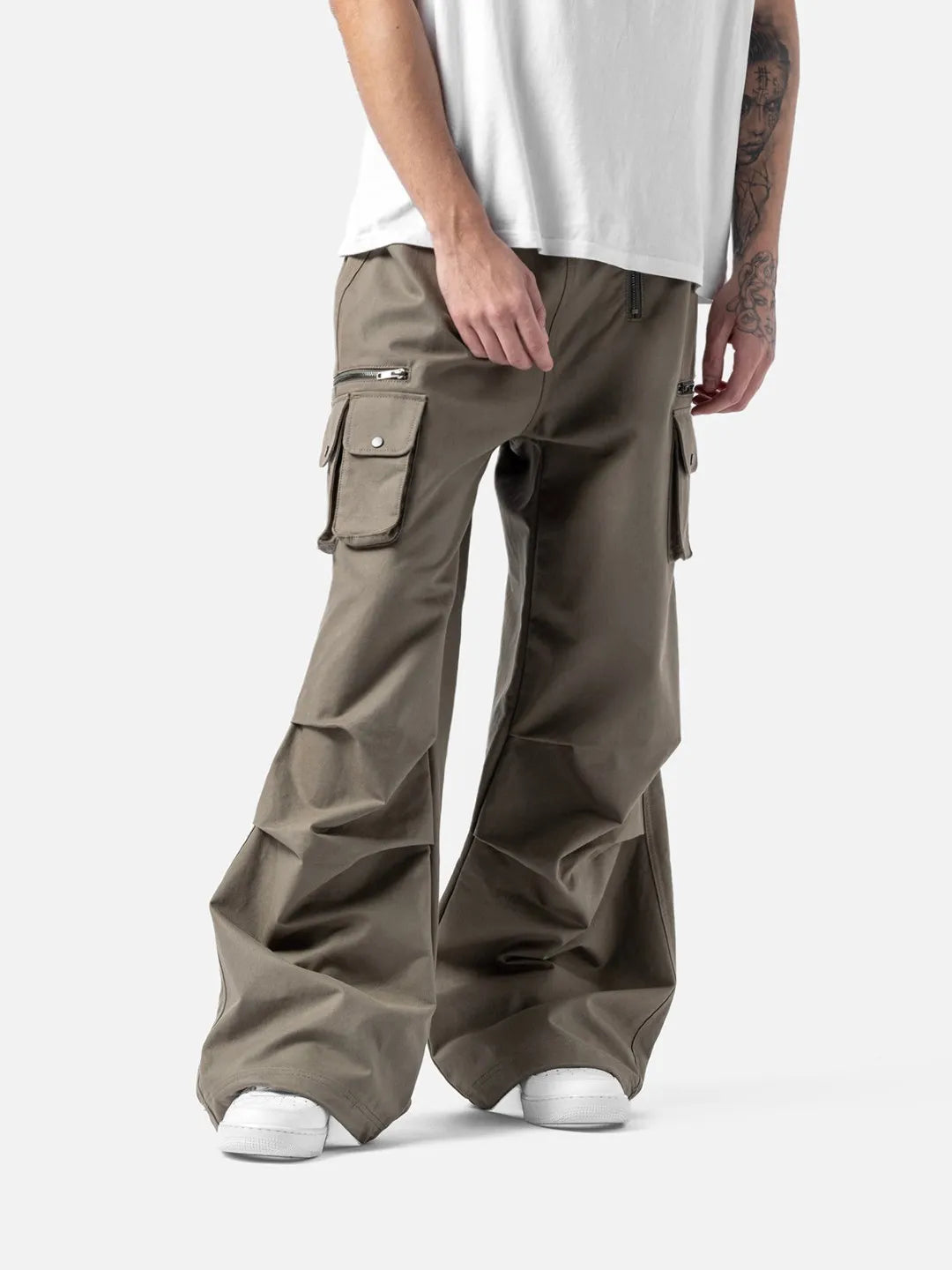 Beige cargo pants with adjustable drawstrings and pockets on a white background