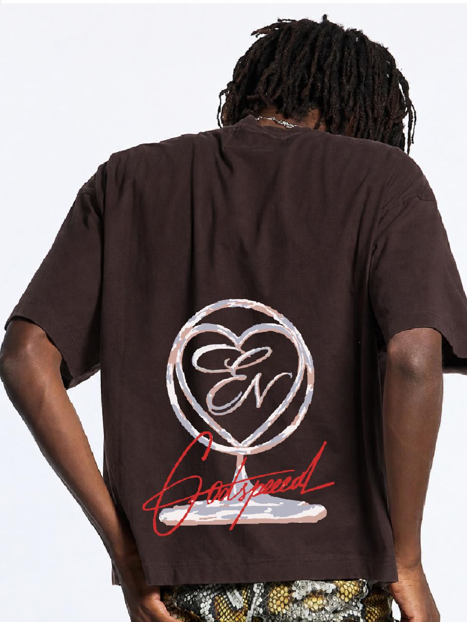 Person wearing a brown t-shirt with a logo and text on the back against a white background