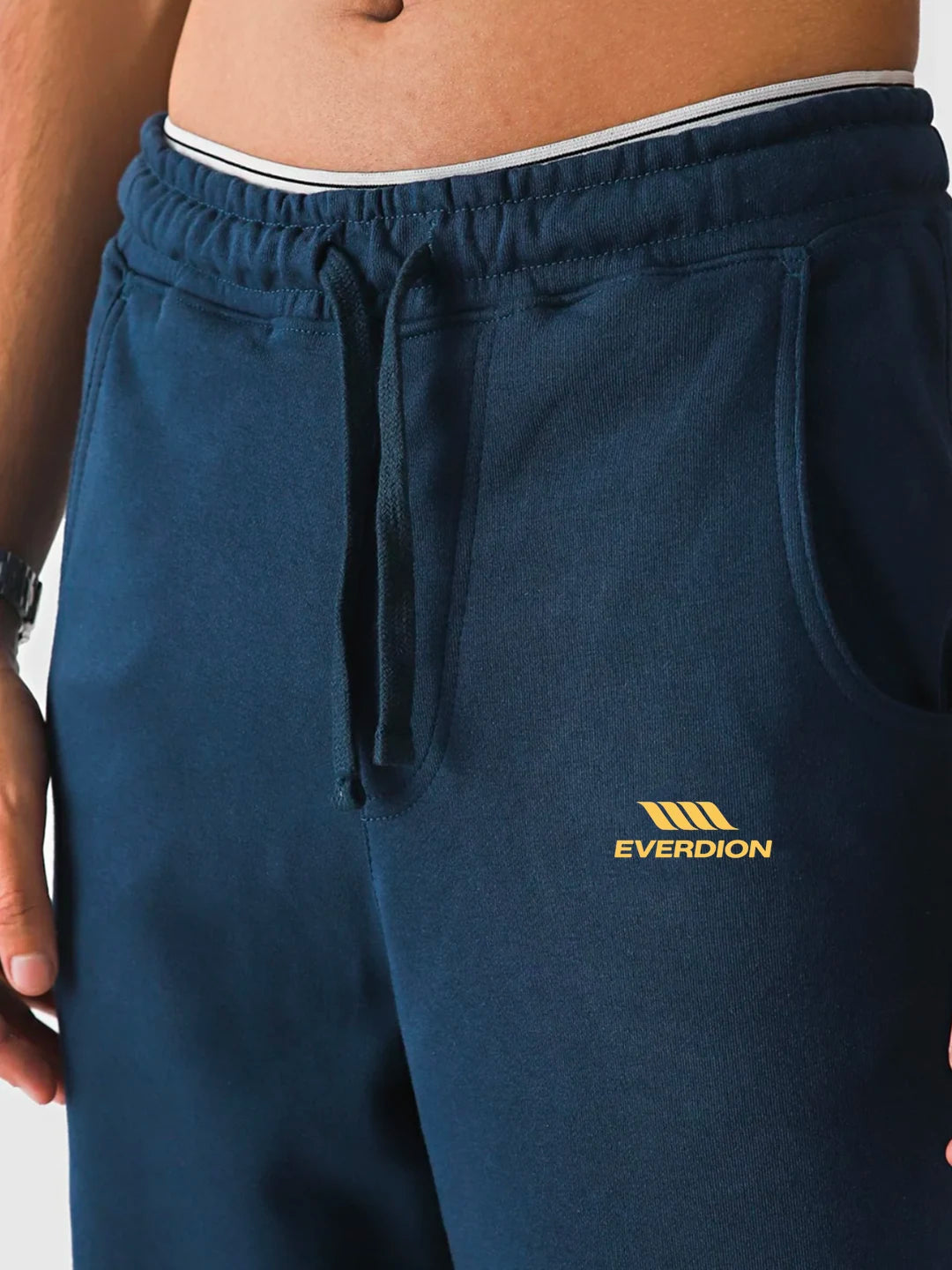 Navy blue sweatpants with 'Everdion' logo on a plain background