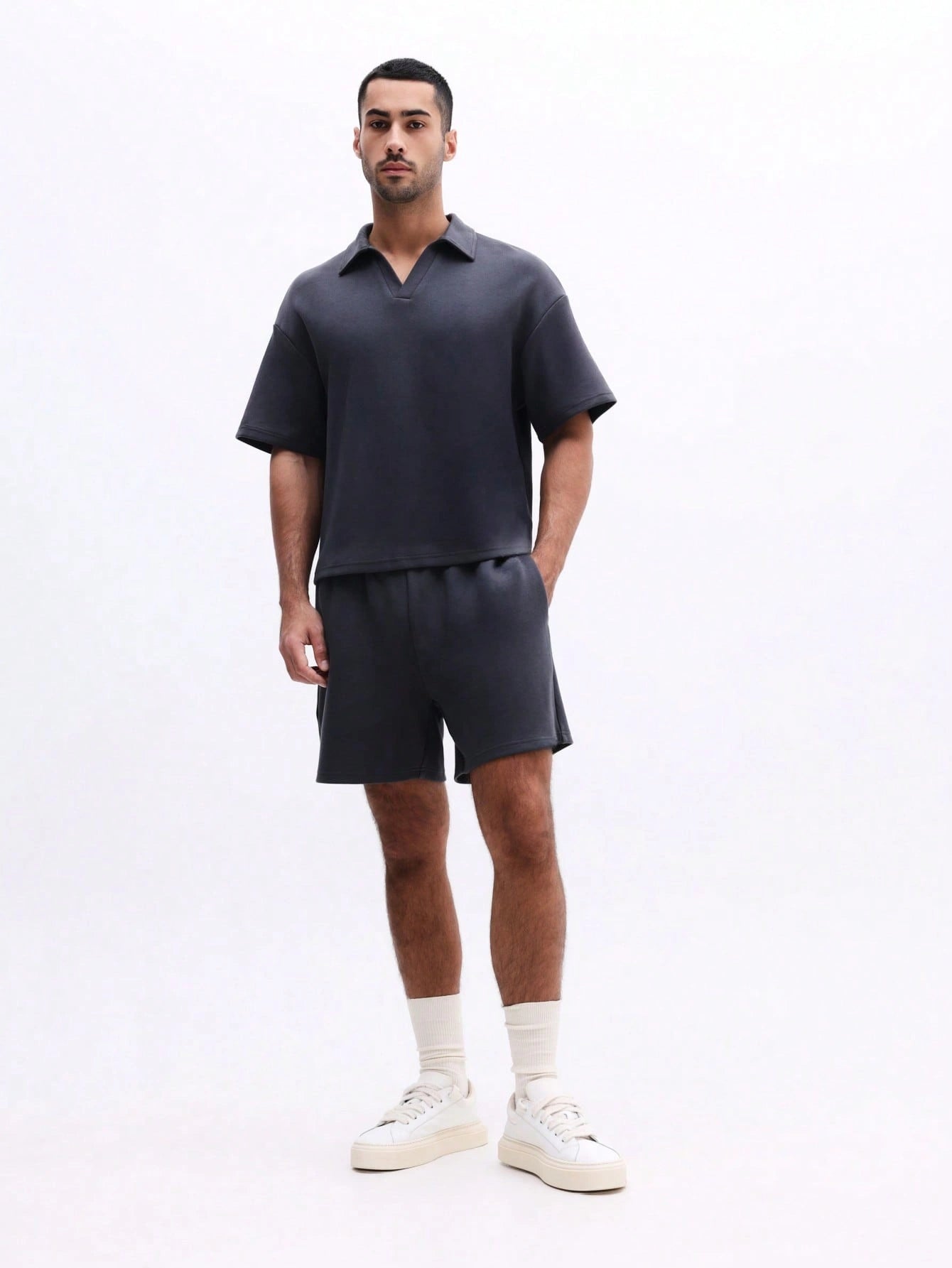 Man wearing Everdion's Collared Polo Top With Shorts Set in Navy color 