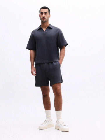 Man wearing Everdion's Collared Polo Top With Shorts Set in Navy color 
