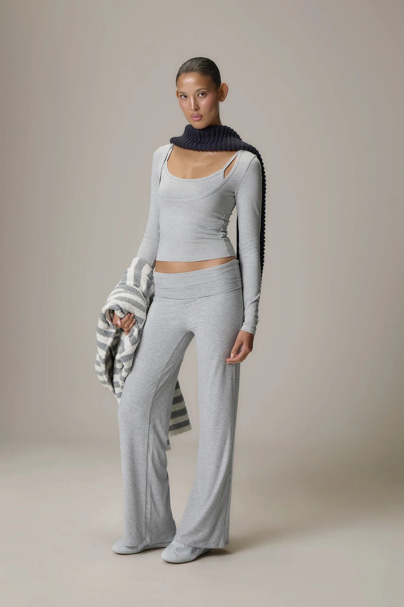 Scoop Neck Top and Fold Over Pant Grey set brings together comfort and contemporary style for everyday wear. The relaxed scoop neck top offers a soft, flattering silhouette that pairs effortlessly with the coordinating fold over pants, crafted in a lightweight, stretch fabric for all-day ease.
 