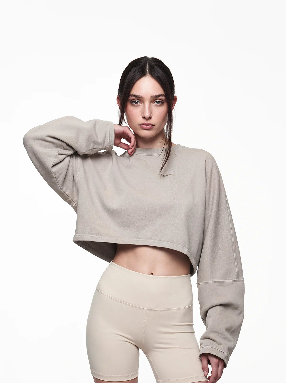 Woman wearing sand color cult cover crop tee
