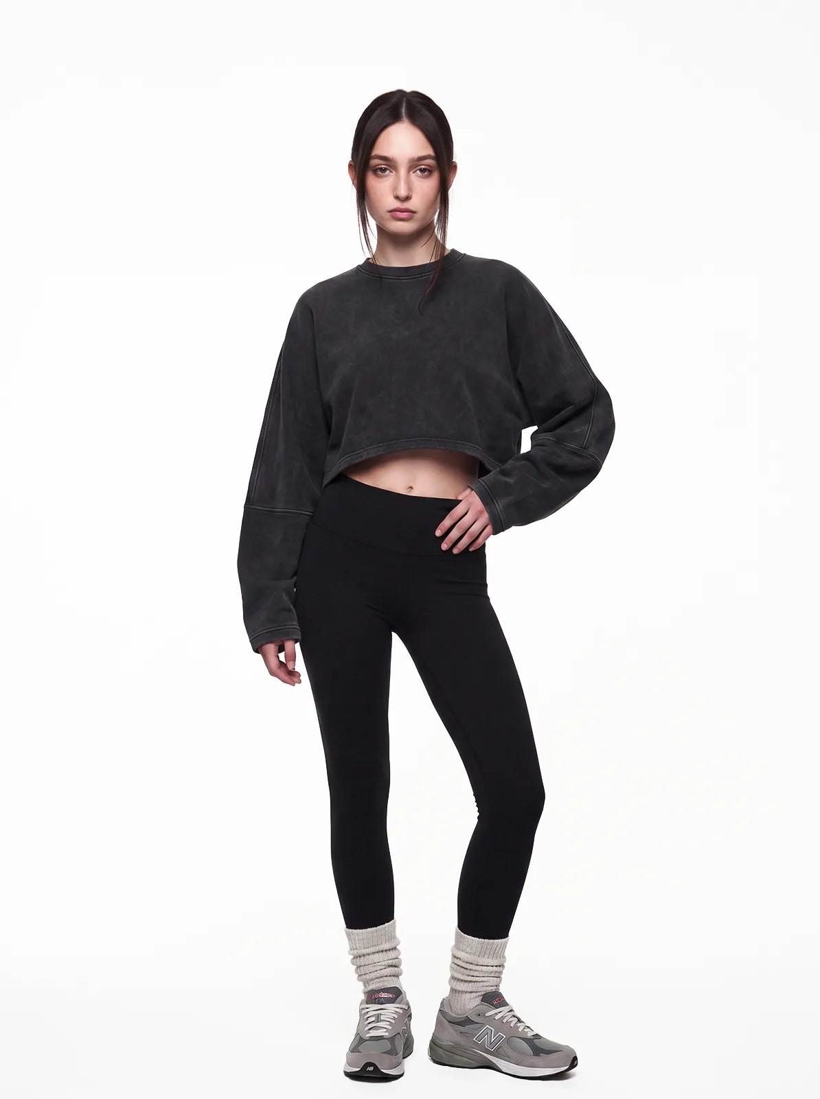 Woman wearing washed black cult cover crop tee
