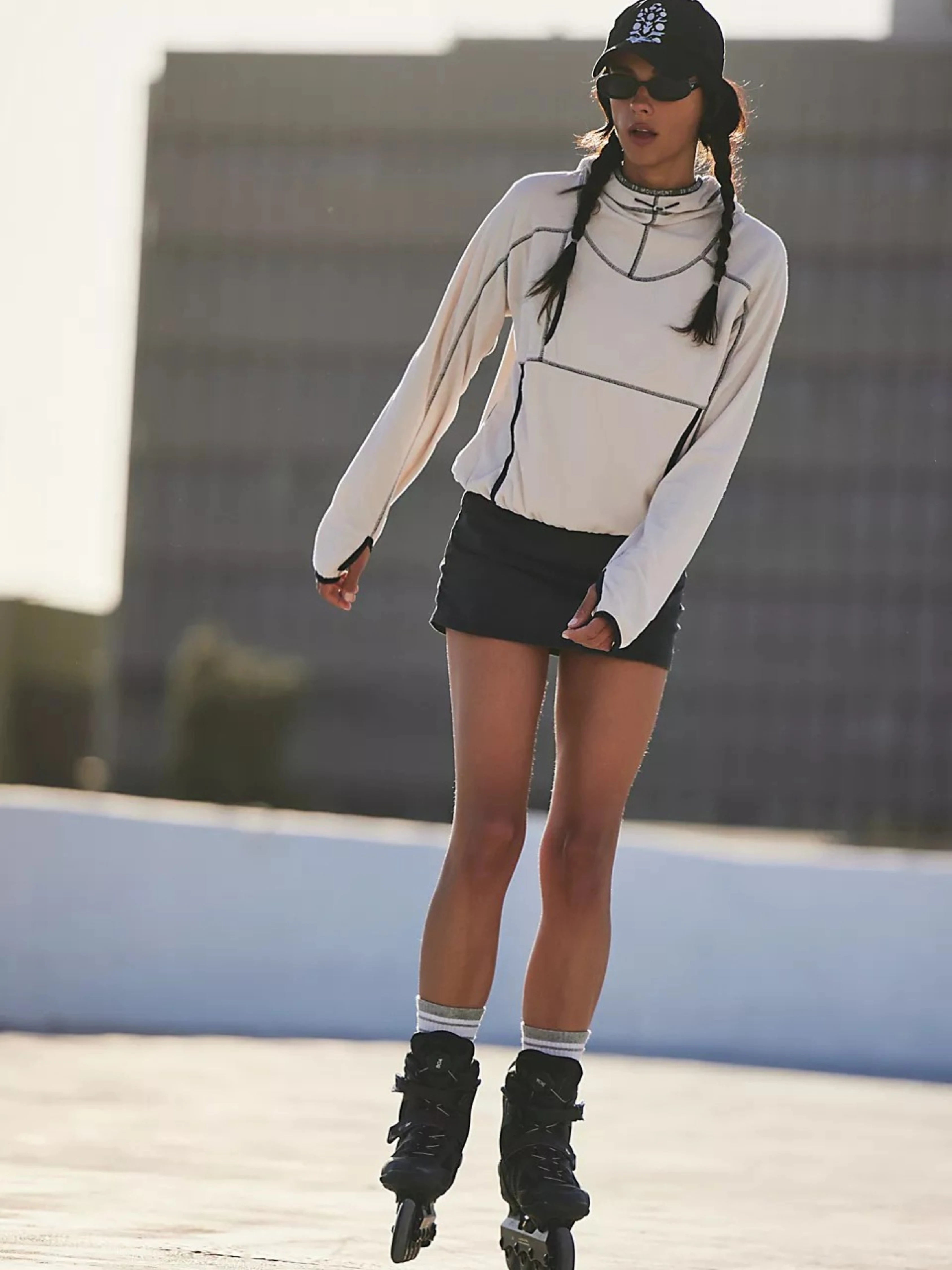 Person rollerblading on a concrete surface with a blurred background