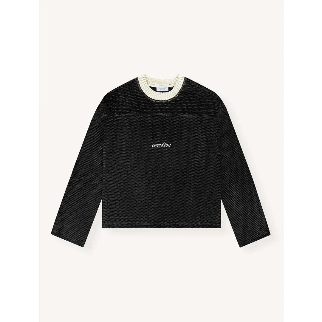 Black textured sweater with white collar on a light gray background