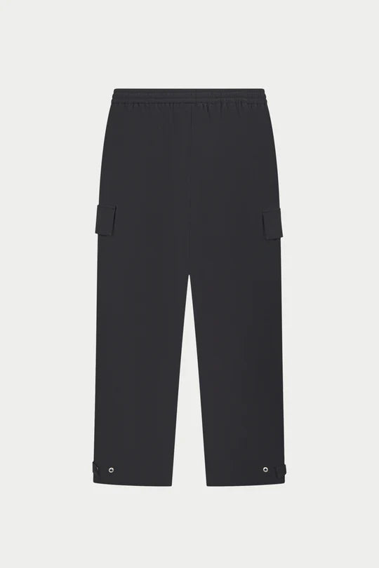 Kyoto Black Cargo Pant is a modern utility essential designed with a relaxed wide-leg silhouette for effortless everyday wear. Crafted with a technical, structured fabric, these cargo pants balance durability with comfort, making them ideal for contemporary streetwear and elevated casual styling.