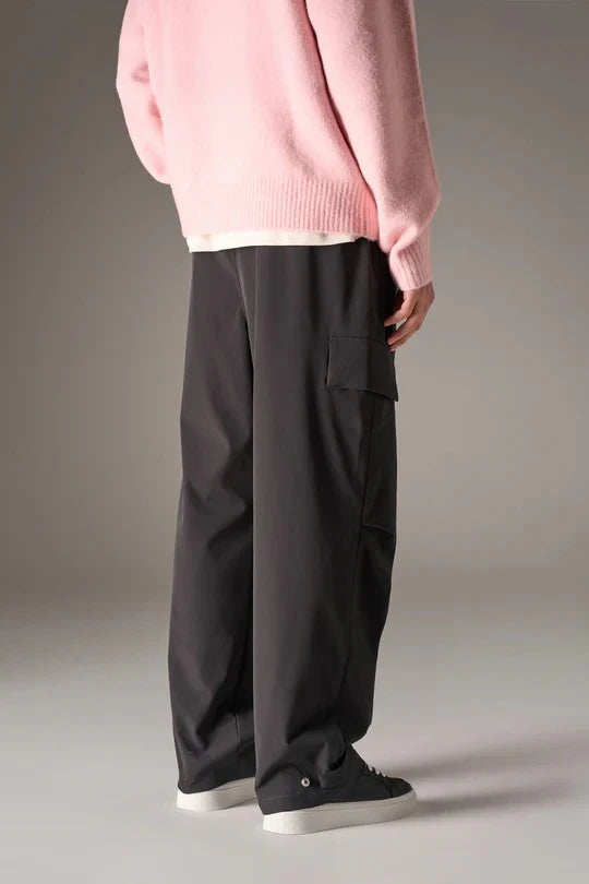 Kyoto Black Cargo Pant is a modern utility essential designed with a relaxed wide-leg silhouette for effortless everyday wear. Crafted with a technical, structured fabric, these cargo pants balance durability with comfort, making them ideal for contemporary streetwear and elevated casual styling.