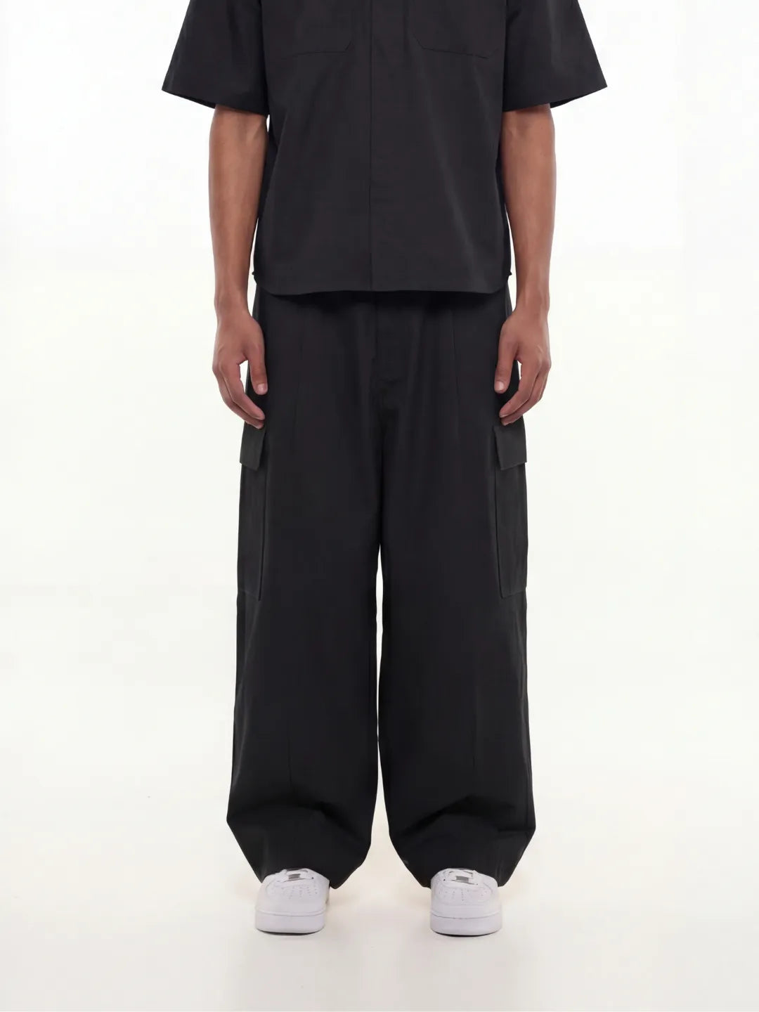 Person wearing a black cargo pants