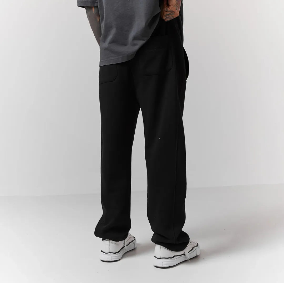 Person wearing black jogger 