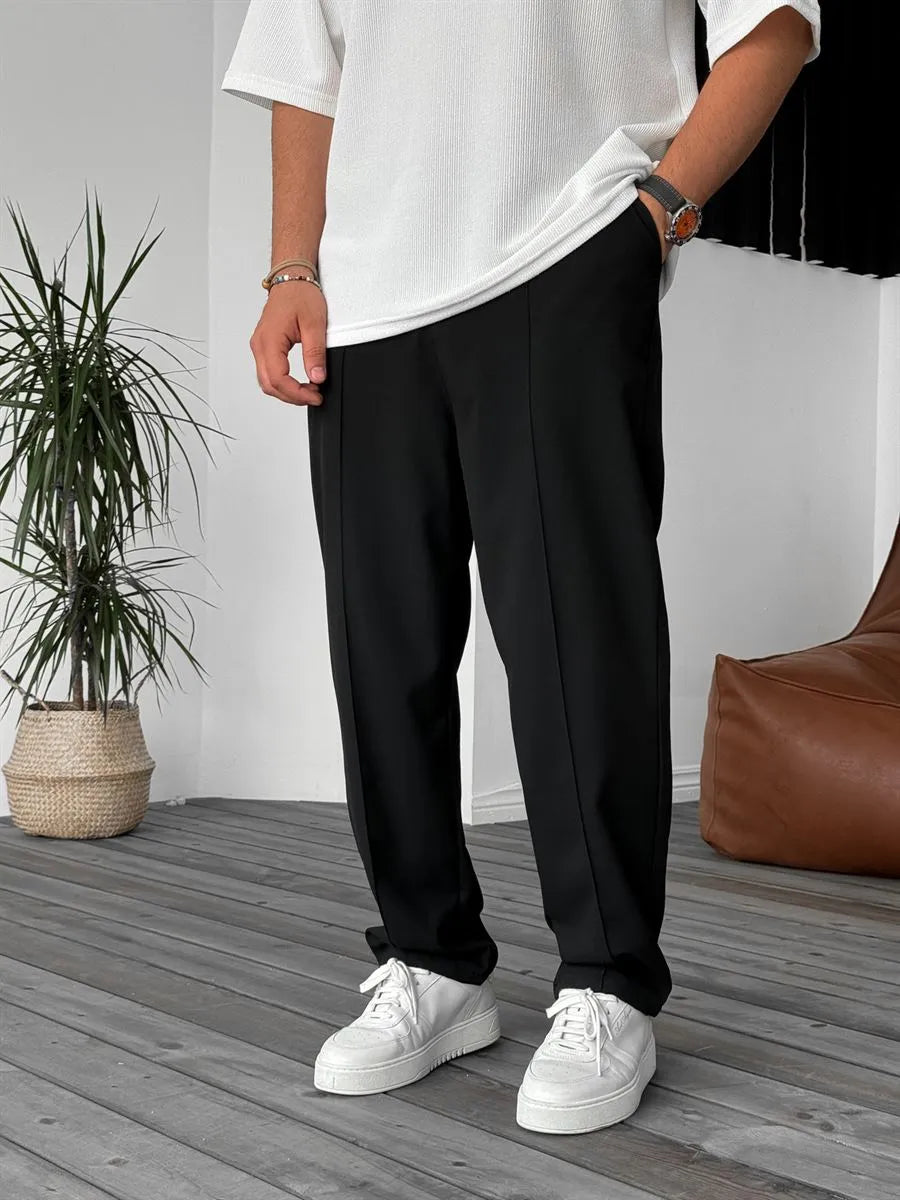 Person wearing black office straight fit pants 