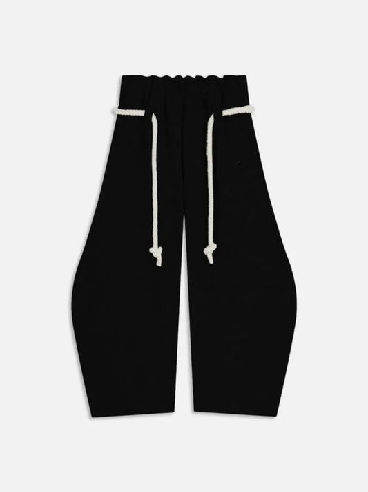 Black high-waisted sweatpants with drawstrings on a white background