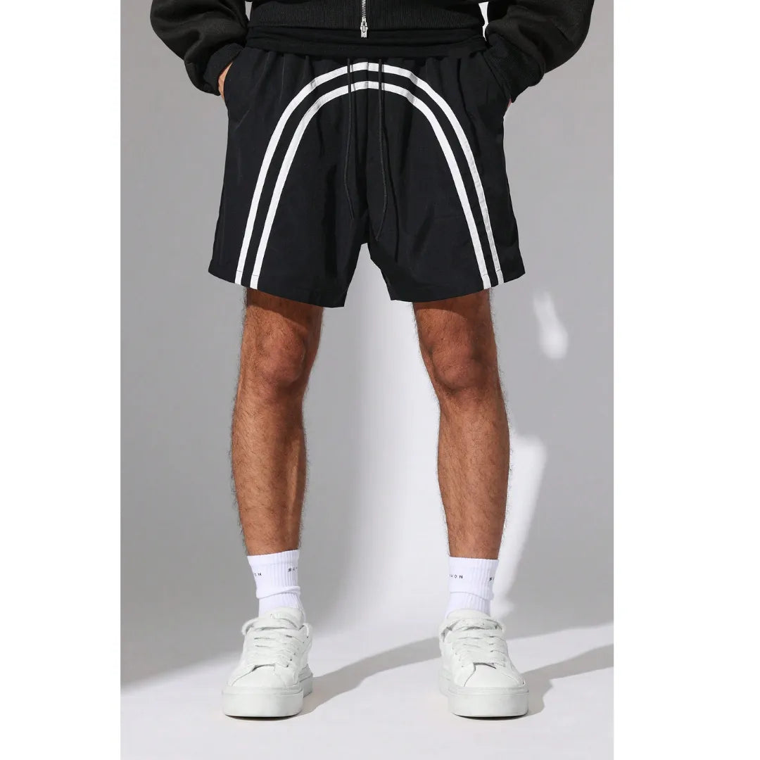 Person wearing black Nylon Race Shorts