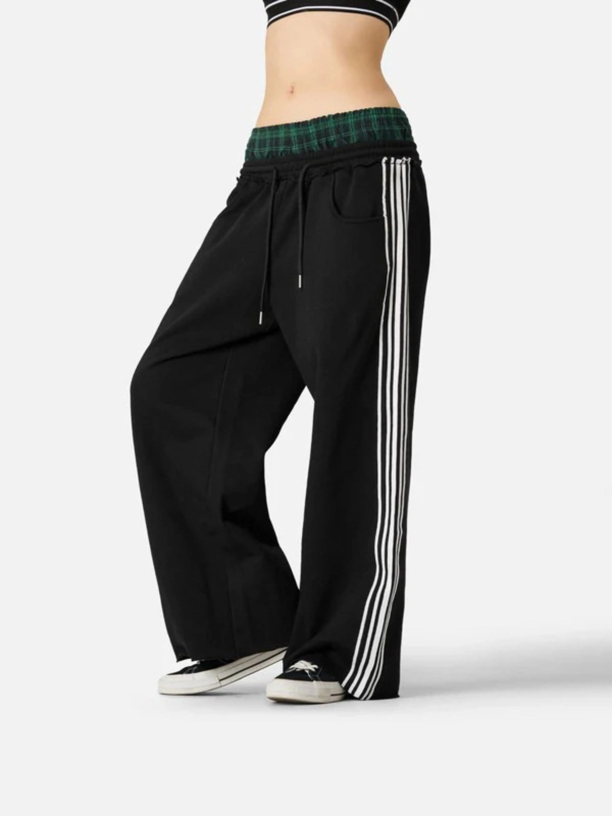 Person wearing black boxer waist sweatpants 