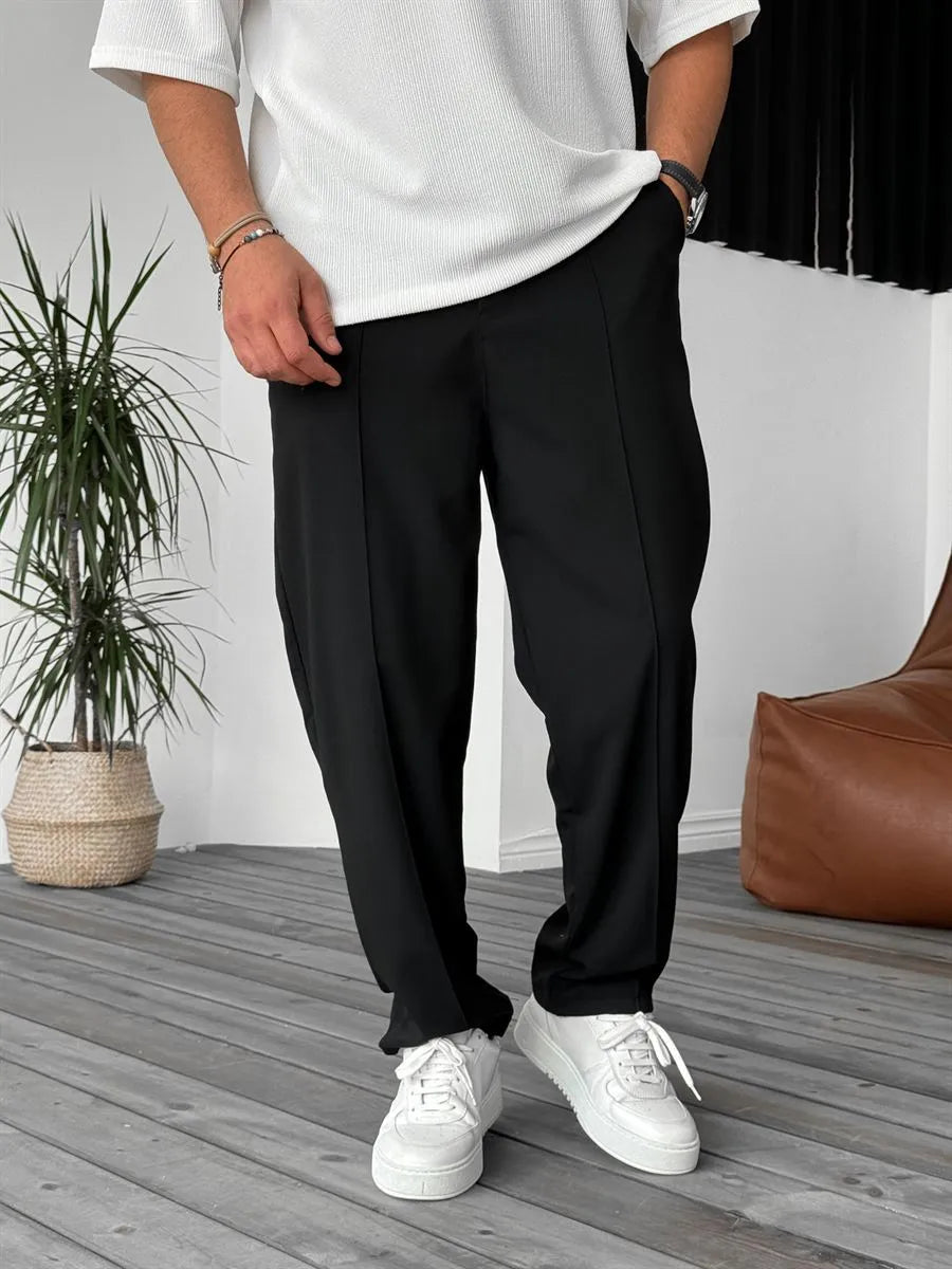 Person wearing black office straight fit pants 