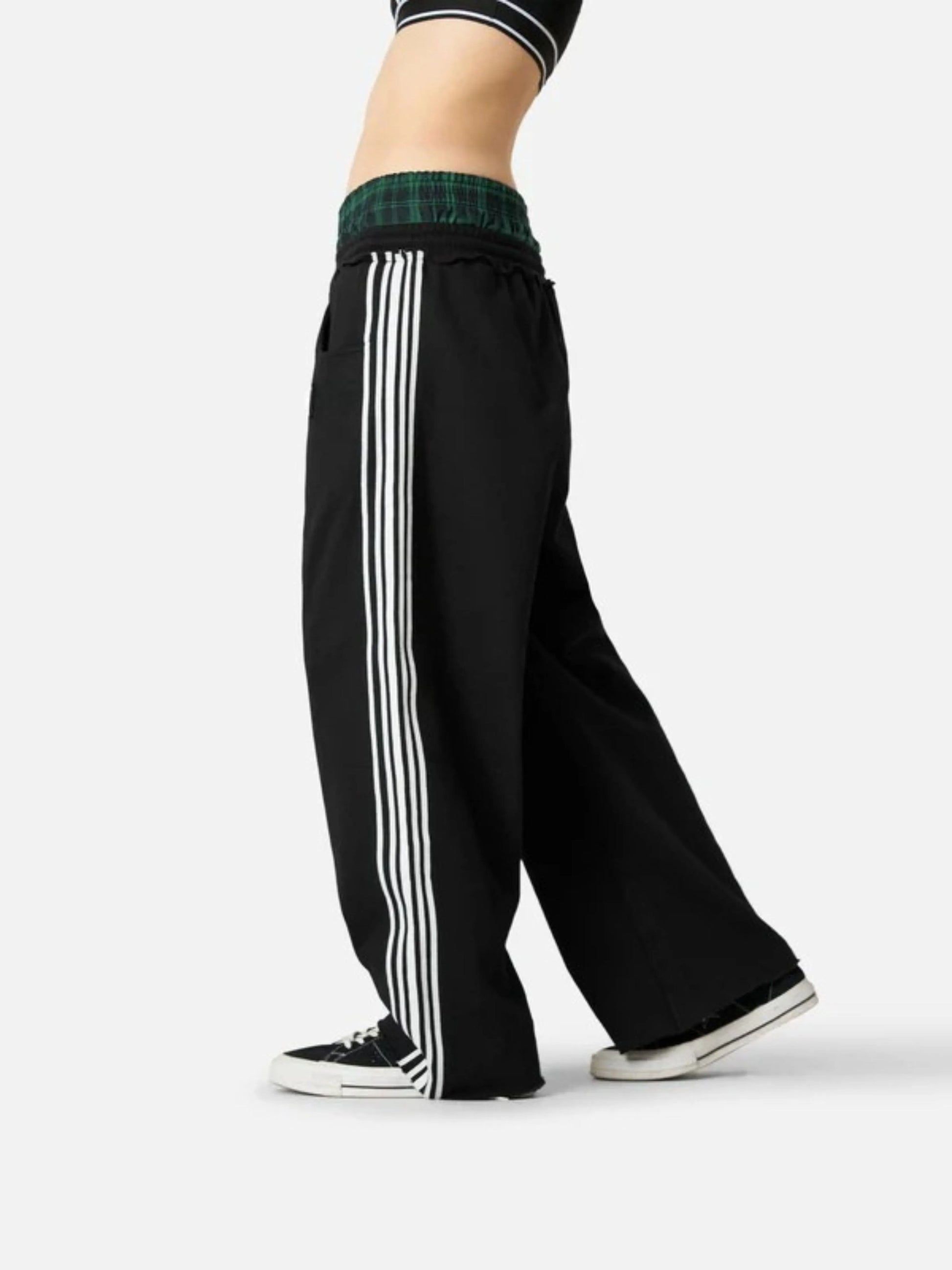 Person wearing black boxer waist sweatpants 